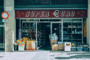 a store front with a bunch of flowers in front of it